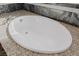 Close-up of a soaking tub with granite surround at 2672 Mystere Ct, Las Vegas, NV 89117