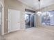Dining area with chandelier, sliding glass door, and neutral carpeting at 3351 Indian Shadow St # 204, Las Vegas, NV 89129