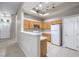 A bright kitchen features wooden cabinets and modern appliances at 3351 Indian Shadow St # 204, Las Vegas, NV 89129