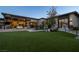 Expansive backyard with outdoor seating and covered patio, perfect for outdoor living at 3452 Spanish Winds Ct, Las Vegas, NV 89141