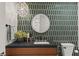 Modern bathroom with a stylish vanity, unique tile backsplash, and pendant lighting for an elegant touch at 3452 Spanish Winds Ct, Las Vegas, NV 89141