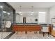 Contemporary bathroom features a sleek vanity with double sinks, stone countertops, and modern lighting fixtures at 3452 Spanish Winds Ct, Las Vegas, NV 89141