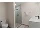 Minimalist bathroom featuring a glass-enclosed shower and modern fixtures at 3452 Spanish Winds Ct, Las Vegas, NV 89141