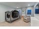 Cozy bedroom with light walls, carpet, and a comfortable chair at 3452 Spanish Winds Ct, Las Vegas, NV 89141