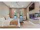 Well-lit bedroom with patterned wallpaper and a glass enclosed fish tank feature at 3452 Spanish Winds Ct, Las Vegas, NV 89141