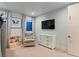 Comfortable bedroom featuring a cozy chair, books, and ample natural light at 3452 Spanish Winds Ct, Las Vegas, NV 89141