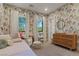 Charming bedroom featuring playful wallpaper, large windows, and stylish furnishings for a cozy atmosphere at 3452 Spanish Winds Ct, Las Vegas, NV 89141