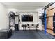 Home gym featuring state-of-the-art workout equipment, mounted TV, and modern lighting at 3452 Spanish Winds Ct, Las Vegas, NV 89141