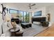 Elegant living room featuring hardwood floors, modern furnishings, and natural light at 3452 Spanish Winds Ct, Las Vegas, NV 89141