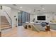 Bright living room with large windows, hardwood floors, and a playful climbing/hiding structure at 3452 Spanish Winds Ct, Las Vegas, NV 89141