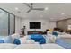 Spacious living room with plush seating, modern lighting, and views to an enclosed outdoor area at 3452 Spanish Winds Ct, Las Vegas, NV 89141