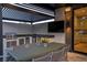 Outdoor kitchen featuring built-in grill, dining space, and modern appliances at 3452 Spanish Winds Ct, Las Vegas, NV 89141