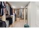 Well-organized walk-in closet offers ample storage space with custom shelves, drawers, and hanging racks at 3452 Spanish Winds Ct, Las Vegas, NV 89141