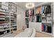 Spacious walk-in closet with custom shelving, drawers, and ample storage for shoes, clothing and accessories at 3452 Spanish Winds Ct, Las Vegas, NV 89141
