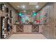 Modern wine cellar featuring custom racks, wood flooring, and ample bottle storage at 3452 Spanish Winds Ct, Las Vegas, NV 89141