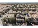 Wide angle aerial view of neighborhood with desert and city views in the distance at 3717 Moonshine Falls Ave, North Las Vegas, NV 89085