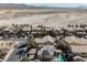 Wide angle aerial shot of homes with solar panels and mountain views in the background at 3717 Moonshine Falls Ave, North Las Vegas, NV 89085