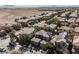 Wide angle aerial view of neighborhood with desert views in the background and some solar panels at 3717 Moonshine Falls Ave, North Las Vegas, NV 89085