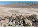 Wide angle aerial shot of neighborhood homes with desert views, mountains, and solar panels at 3717 Moonshine Falls Ave, North Las Vegas, NV 89085