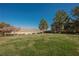 Expansive backyard featuring a lush lawn and mature trees at 3717 Moonshine Falls Ave, North Las Vegas, NV 89085