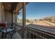 Relaxing balcony features comfortable chairs and picturesque views of neighboring homes at 3717 Moonshine Falls Ave, North Las Vegas, NV 89085