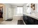 Bright bathroom featuring dual sinks, a soaking tub, and a walk-in shower at 3717 Moonshine Falls Ave, North Las Vegas, NV 89085