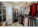 Organized walk-in closet with ample shelving and hanging space for clothes and accessories at 3717 Moonshine Falls Ave, North Las Vegas, NV 89085