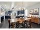 Open-concept dining area seamlessly connects to the kitchen with complementary blue cabinets at 3717 Moonshine Falls Ave, North Las Vegas, NV 89085