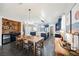 Spacious dining room flows into an open floorplan with bar, kitchen, and eat-in island at 3717 Moonshine Falls Ave, North Las Vegas, NV 89085