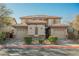 Charming home featuring a well-manicured front yard and attached two-car garages with a shared facade at 3717 Moonshine Falls Ave, North Las Vegas, NV 89085