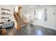 Inviting foyer with modern tile floors, an elegant staircase, and a stylish front door at 3717 Moonshine Falls Ave, North Las Vegas, NV 89085