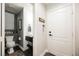 Contemporary half bath with white shiplap accent wall and modern fixtures at 3717 Moonshine Falls Ave, North Las Vegas, NV 89085
