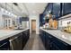Bright, modern kitchen with stainless steel appliances and a stylish countertop space at 3717 Moonshine Falls Ave, North Las Vegas, NV 89085