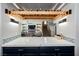 Custom beverage center with marble countertop, wine rack, and glass storage overlooking the living room and staircase at 3717 Moonshine Falls Ave, North Las Vegas, NV 89085
