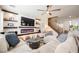 Comfortable living room features a fireplace, built-in shelves, ceiling fan and inviting seating area at 3717 Moonshine Falls Ave, North Las Vegas, NV 89085