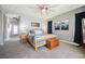 Spacious main bedroom with a ceiling fan, carpet floors, and neutral walls at 3717 Moonshine Falls Ave, North Las Vegas, NV 89085