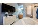Comfortable main bedroom with wood-look floors, large dresser, and a conveniently located en-suite bathroom at 3717 Moonshine Falls Ave, North Las Vegas, NV 89085