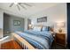Comfortable main bedroom with carpet floors, a ceiling fan, and bedside tables at 3717 Moonshine Falls Ave, North Las Vegas, NV 89085