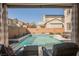 Inviting backyard pool with lounge chairs and desert landscaping at 3717 Moonshine Falls Ave, North Las Vegas, NV 89085
