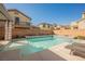 Refreshing pool with a tanning ledge, perfect for relaxation and recreation at 3717 Moonshine Falls Ave, North Las Vegas, NV 89085