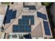 Aerial closeup view of roof showing many solar panels installed on the roof of the house at 3717 Moonshine Falls Ave, North Las Vegas, NV 89085