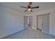 Bedroom with carpeted floors, ceiling fan and closet with sliding doors at 384 E Erin St # 3, Pahrump, NV 89048