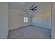 Spacious bedroom features carpet floors and large windows with bright natural light at 384 E Erin St # 3, Pahrump, NV 89048