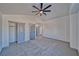 Bedroom with a ceiling fan, carpeted floors and closet with sliding doors at 384 E Erin St # 3, Pahrump, NV 89048