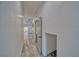 Hallway with wood-look flooring and white walls leading to an open space at 384 E Erin St # 3, Pahrump, NV 89048