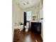 This bathroom has hardwood floors, a dark vanity, and a tub/shower combo with a dark shower curtain at 384 Gracious Way, Henderson, NV 89011