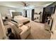 Serene bedroom with mirrored furniture, plush bedding, and ample natural light for a relaxing ambiance at 384 Gracious Way, Henderson, NV 89011
