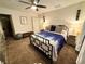 Comfortable bedroom with a ceiling fan, neutral carpet, and coordinated furniture set at 384 Gracious Way, Henderson, NV 89011