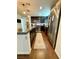 This kitchen features stainless steel appliances, dark cabinets, and an island with a granite countertop at 384 Gracious Way, Henderson, NV 89011