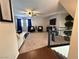 Spacious living room with a ceiling fan, comfortable seating, and access to the second-floor staircase at 384 Gracious Way, Henderson, NV 89011